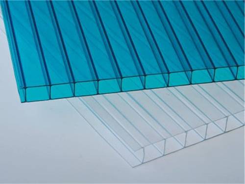 A blue and a white twin-wall polycarbonate sheets on the gray background.